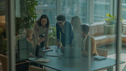 A Co-Managed IT Services team gathers around a table to support a client