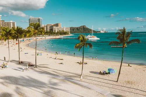 Photo of Waikiki beach, including Diamondhead peak on the horizon.